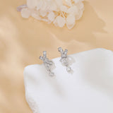 925 Sterling Silver Elegant Silver Moissanite Cross Earrings With Dangling Round Stones
