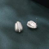 925 Sterling Silver Elegant Silver Ribbed Earrings With Zircon Accents On Textured Black Surface
