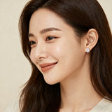 925 Sterling Silver Elegant Silver Ribbed Earrings With Zircon Accents On Textured Black Surface