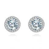 925 Sterling Silver Elegant Moissanite Halo Stud Earrings On Black Wood With Teal Background