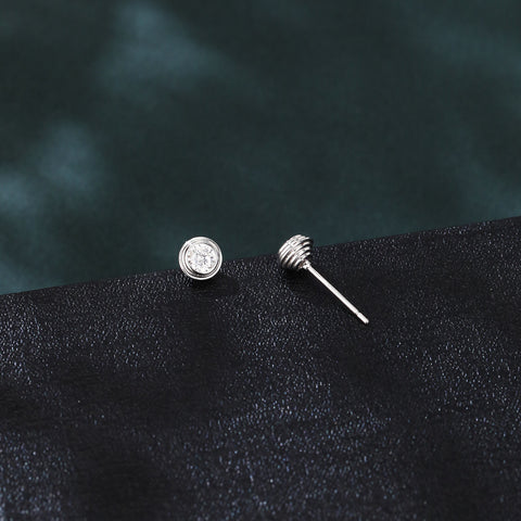 925 Sterling Silver Elegant Moissanite Stud Earrings On Black Leather With Green Velvet Background