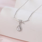 925 Sterling Silver Elegant Zircon Teardrop Necklace With Bow Accent In Sterling Silver
